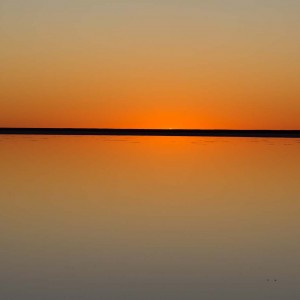 Sunrise reflection at Lake Eyre South Australia