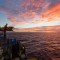 Oil rig sunrise at sea Mount Taranaki