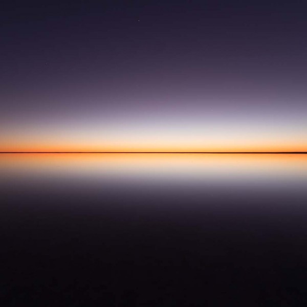 Lake Eyre sunrise sky reflection in water horizon